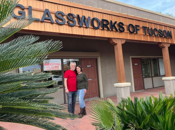 Terry Kellman and wife in front of Glassworks of Tucson storefront